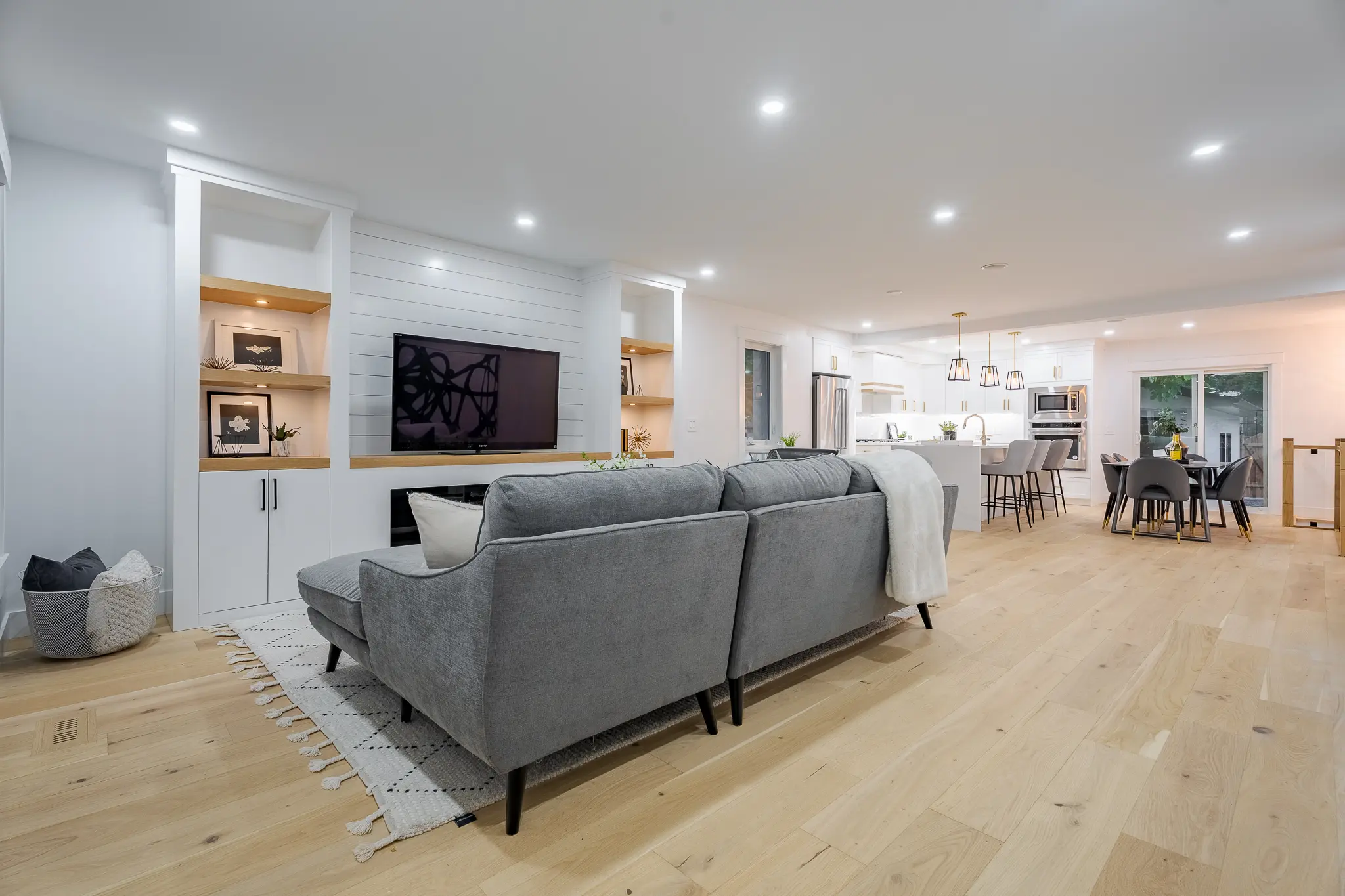 A living room with a couch and a television.