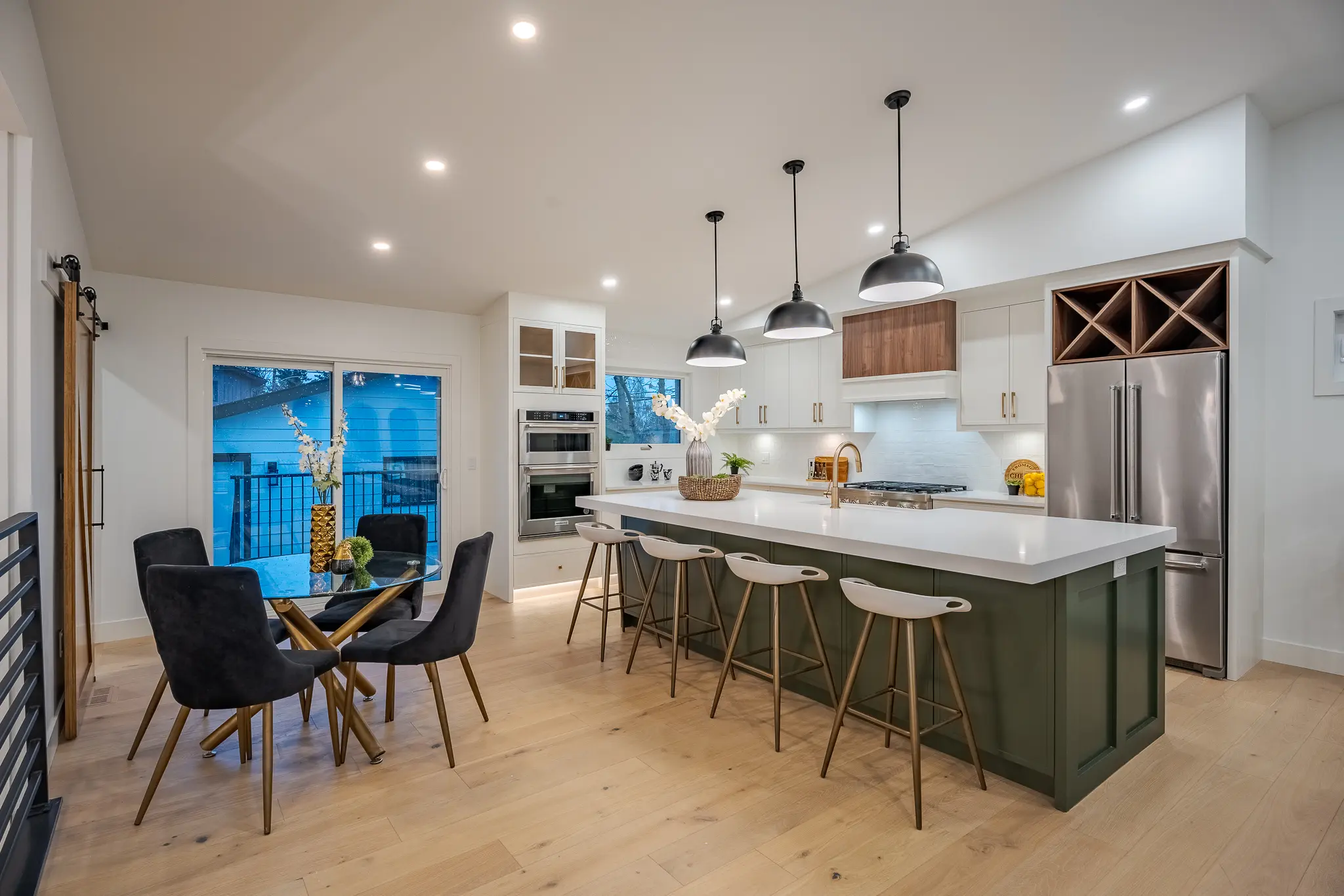 A kitchen with a table and chairs in it