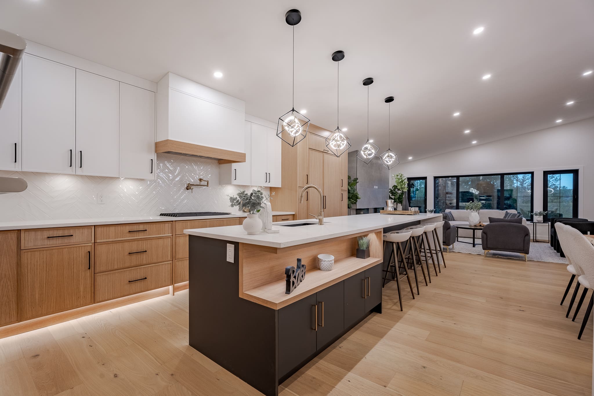 A kitchen with a large island and wooden cabinets.