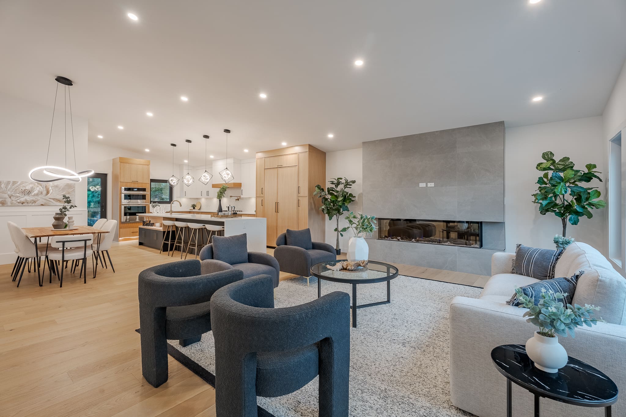 A living room with couches and chairs in it