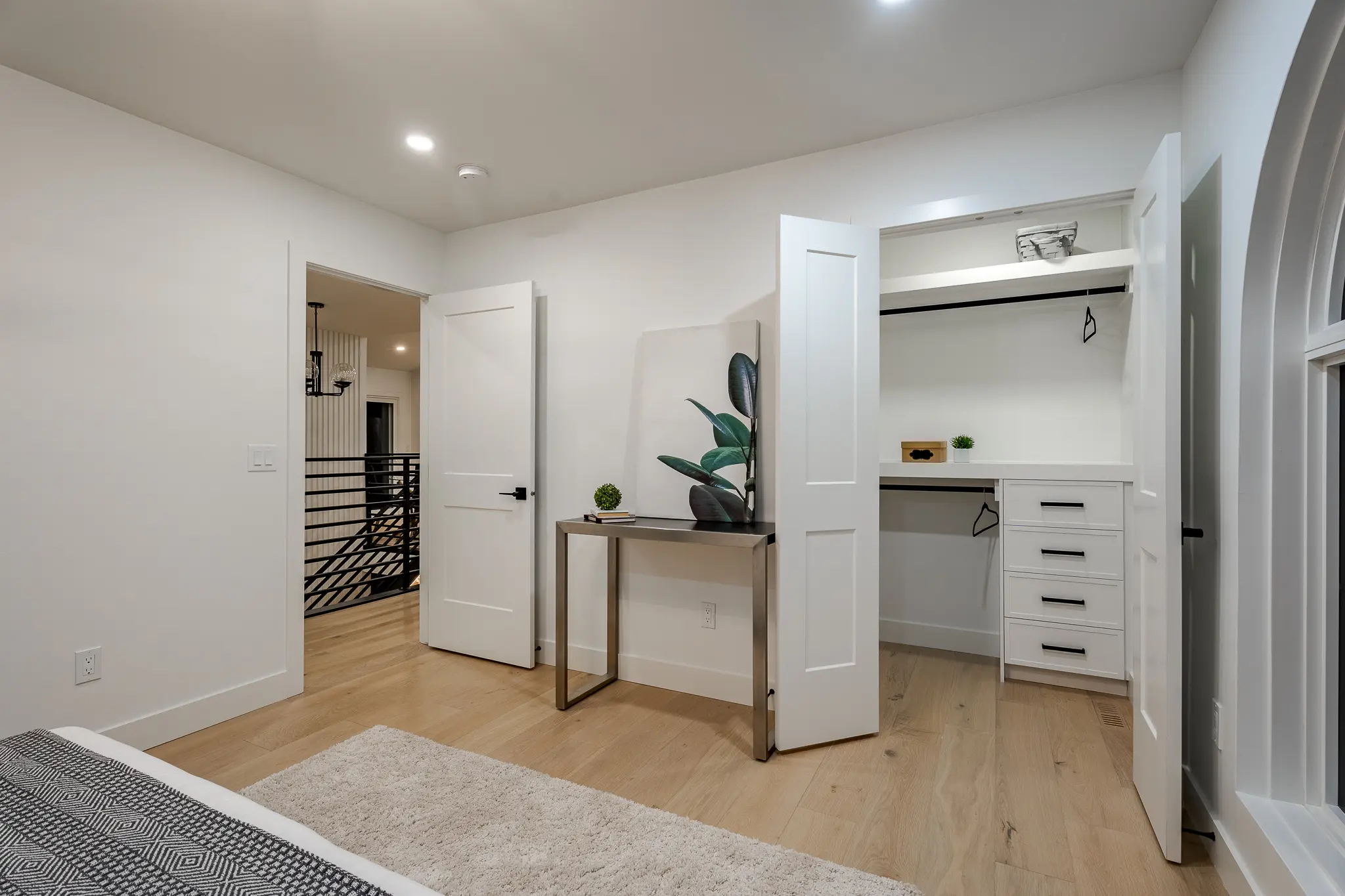 A room with white walls and wooden floors.