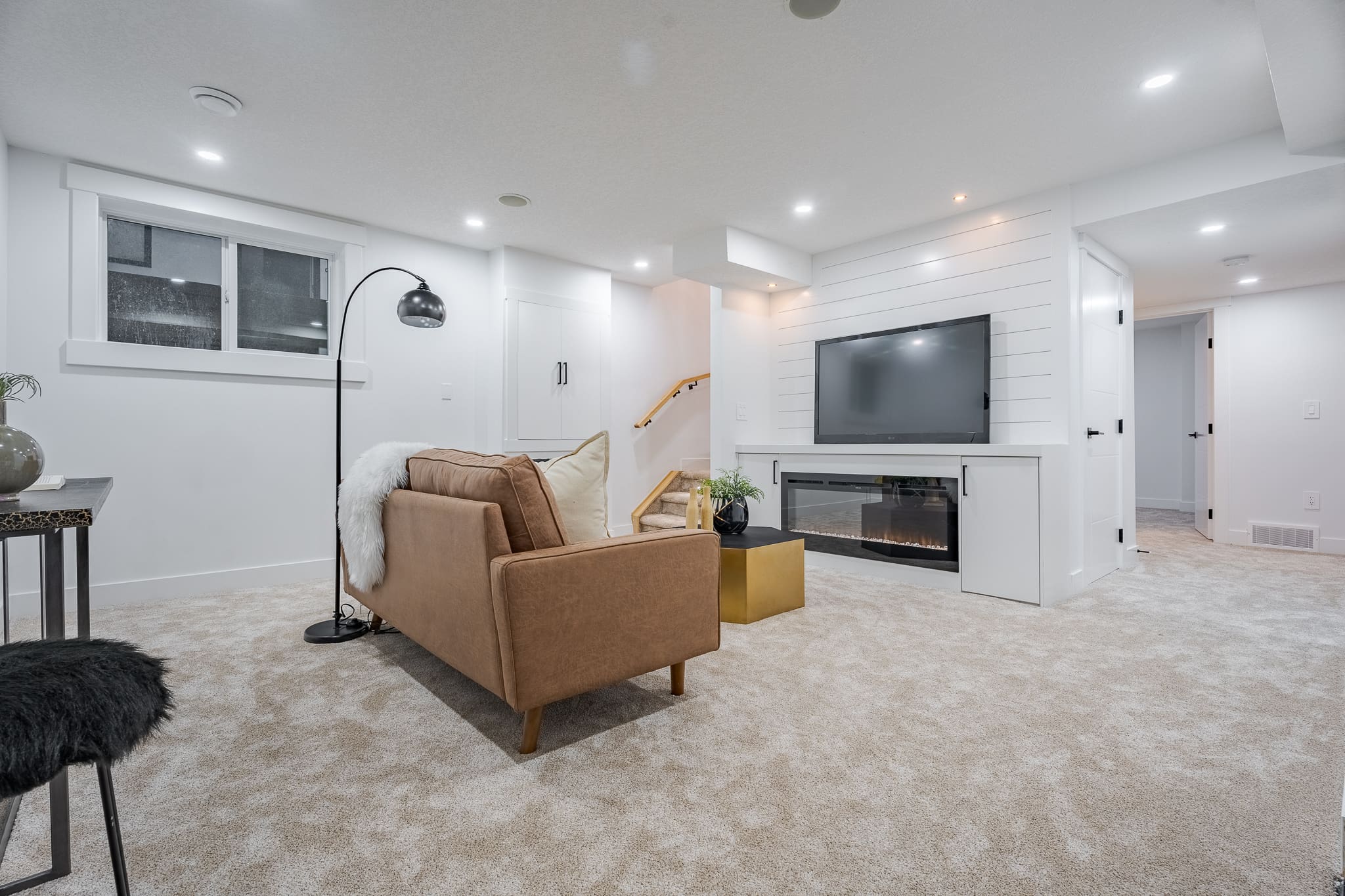 A living room with a couch and television