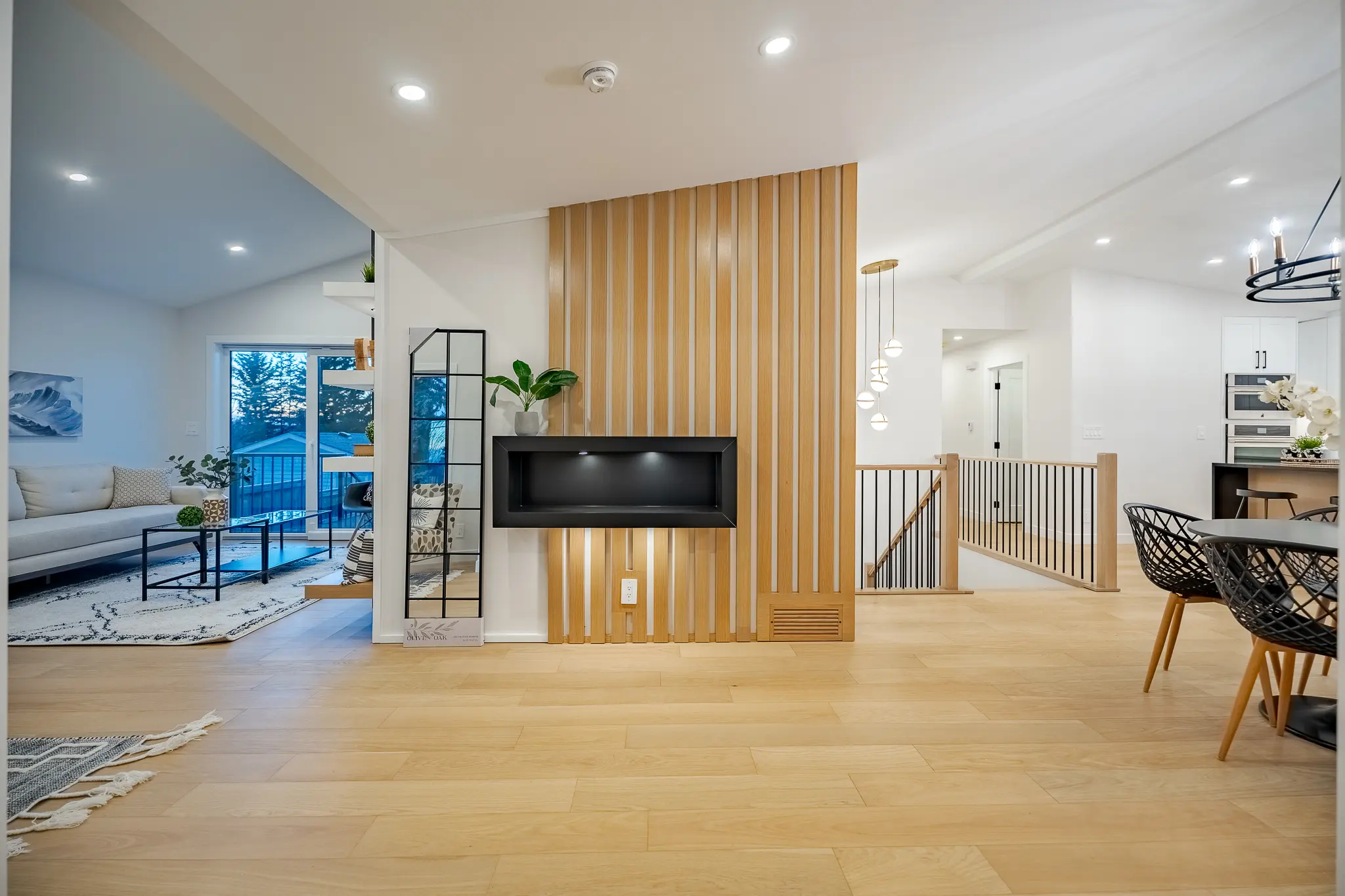 A room with wood paneling and a fireplace.